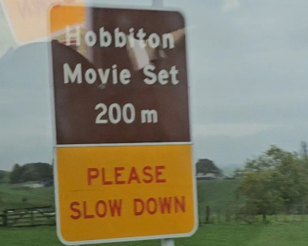 Road sign pointing toward the Hobbiton Movie Set in New Zealand.